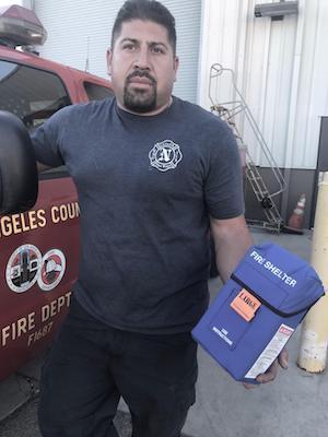 AFSCME member Frankie Martinez standing in front of a LA Co. Fire Department vehicle